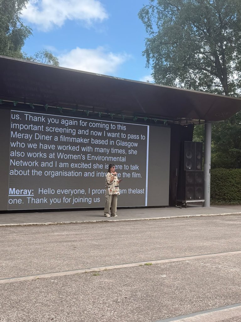 Meray infront of a screen